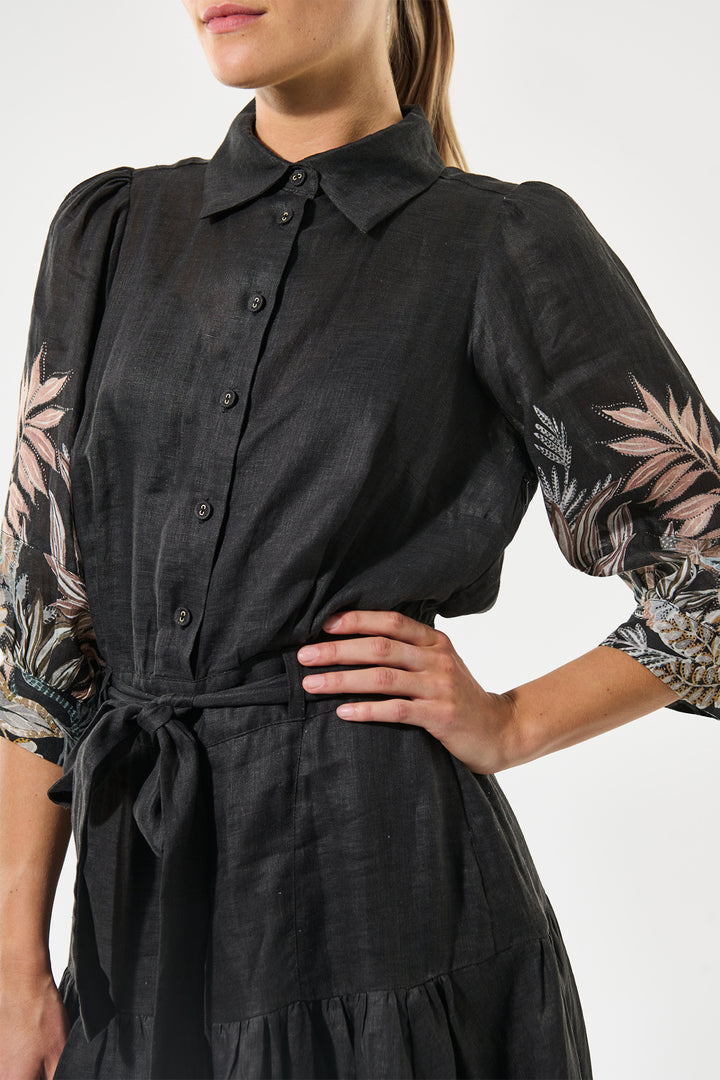 Black dress with floral sleeves on a white background