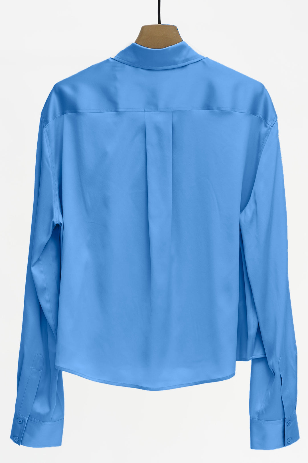 Blue shirt on a hanger against a white background