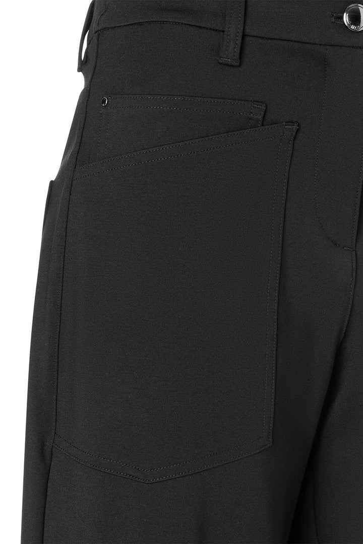 Close-up of black pants with a pocket on a white background