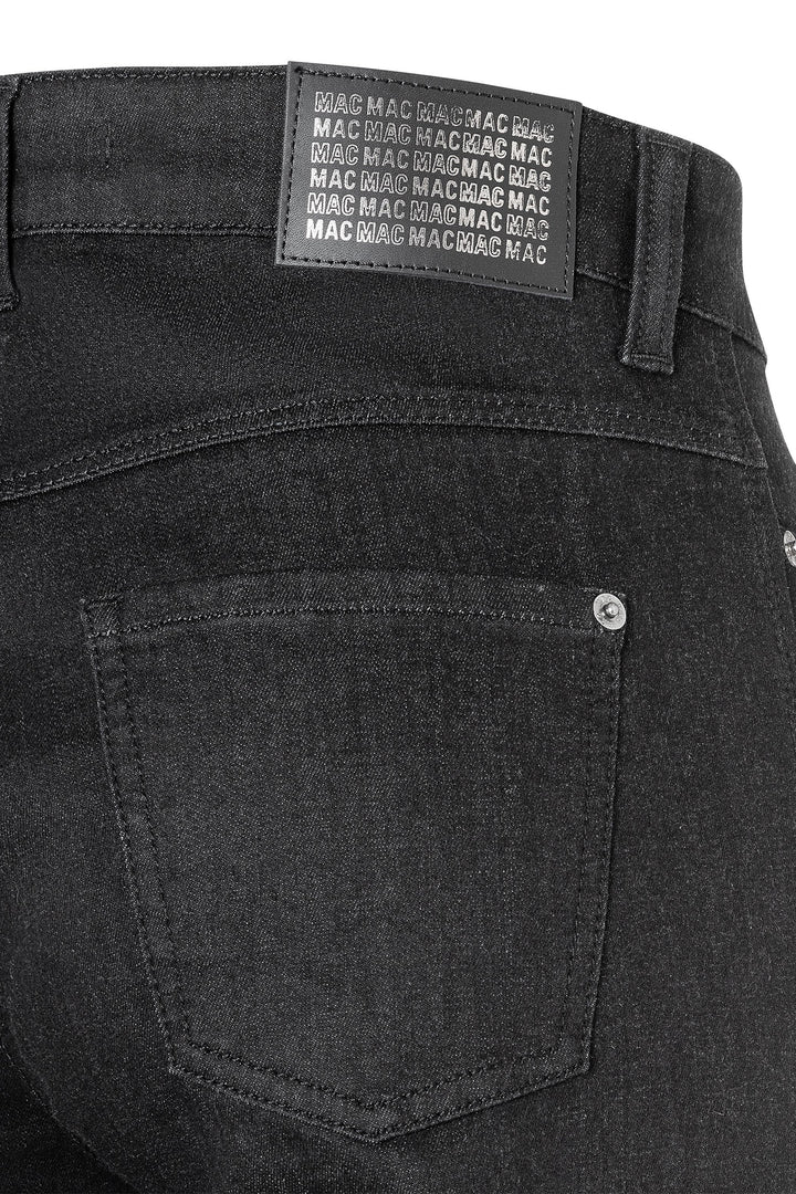 Black jeans with a MAC label on the back pocket