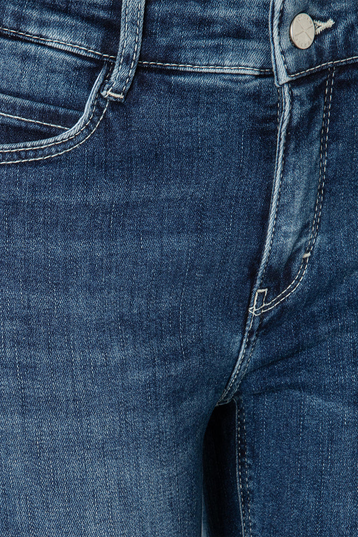 Close-up of blue denim jeans with stitching details