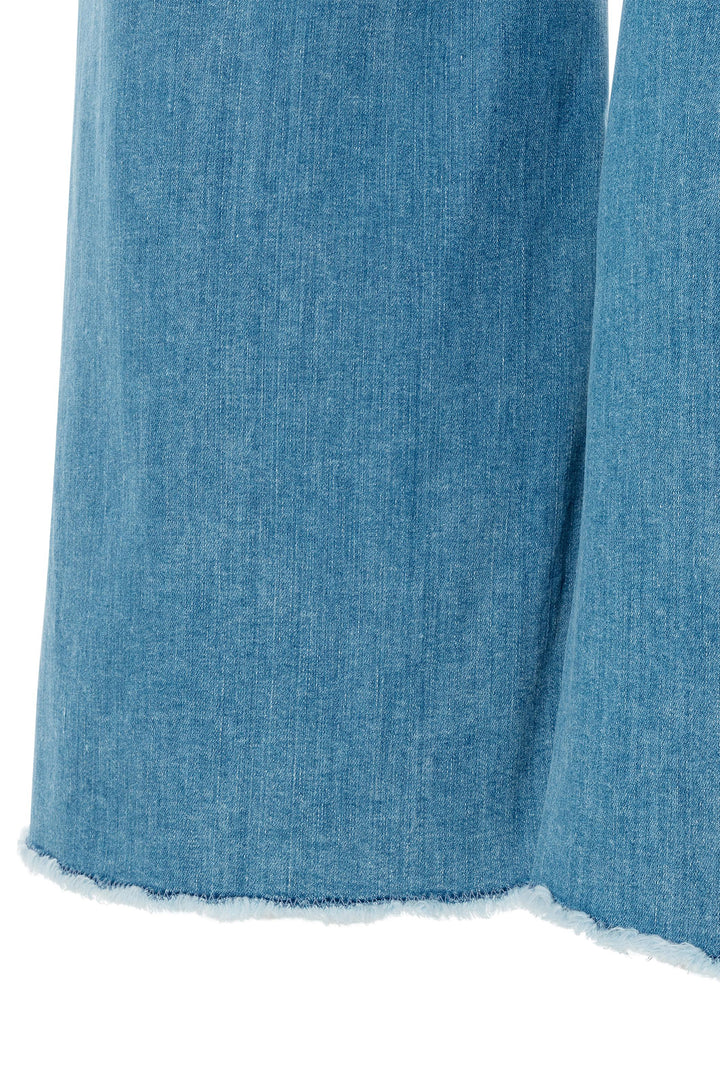 Close-up of blue denim fabric on a white background
