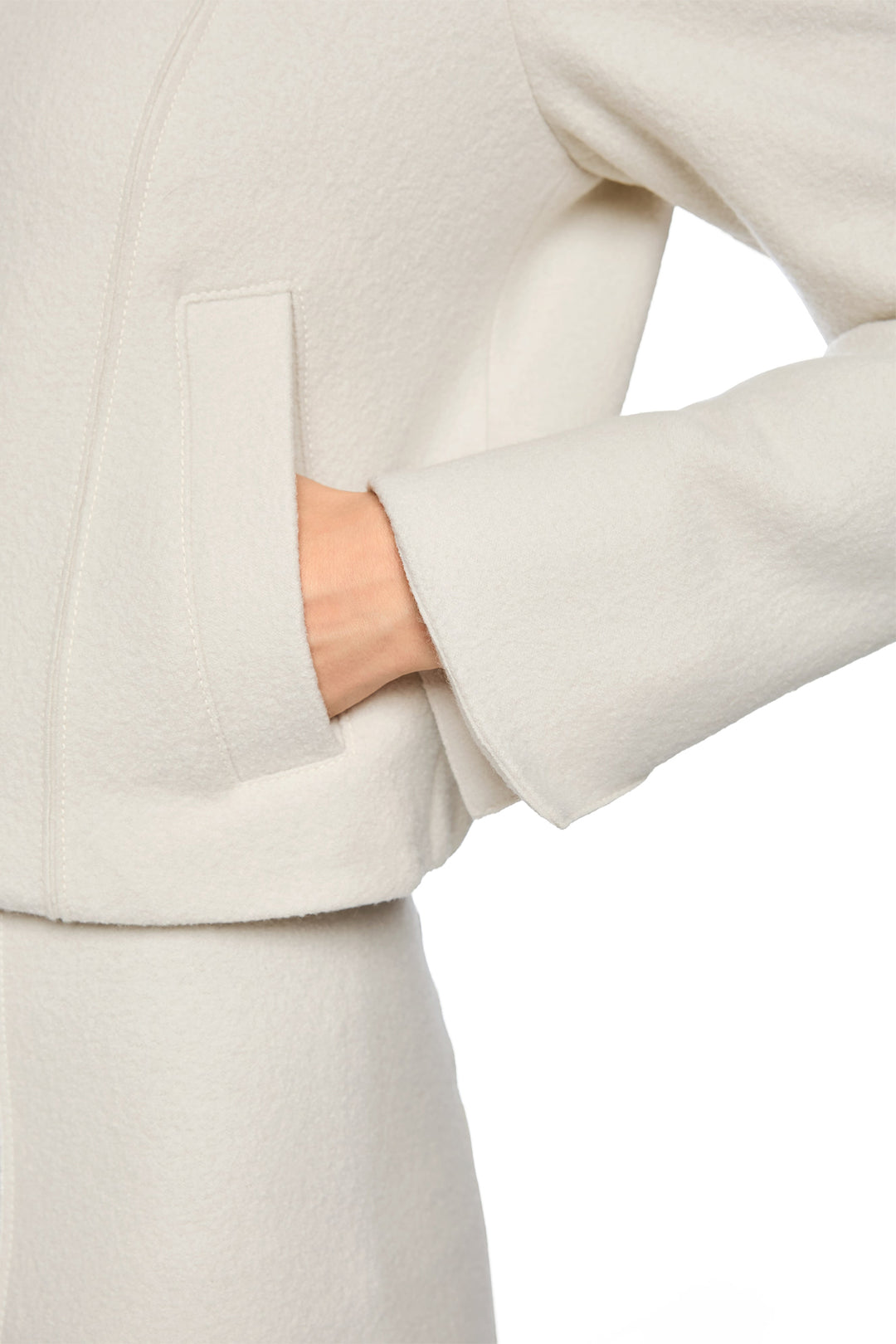 Close-up of a beige coat with a blurred background
