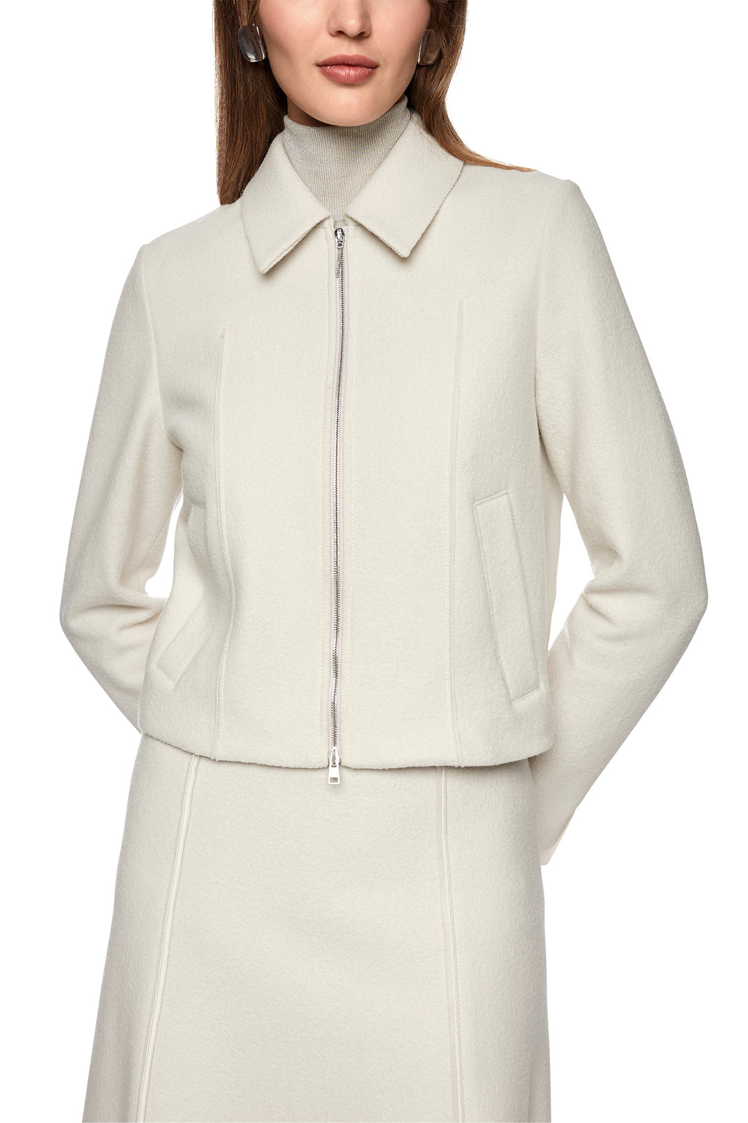 White jacket worn by a person on a white background