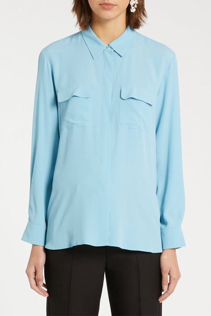 Light blue shirt worn by a person on a white background