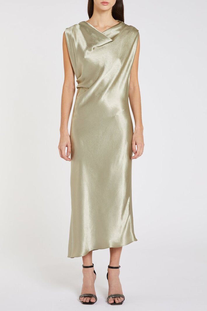 Woman wearing a green satin dress on a white background