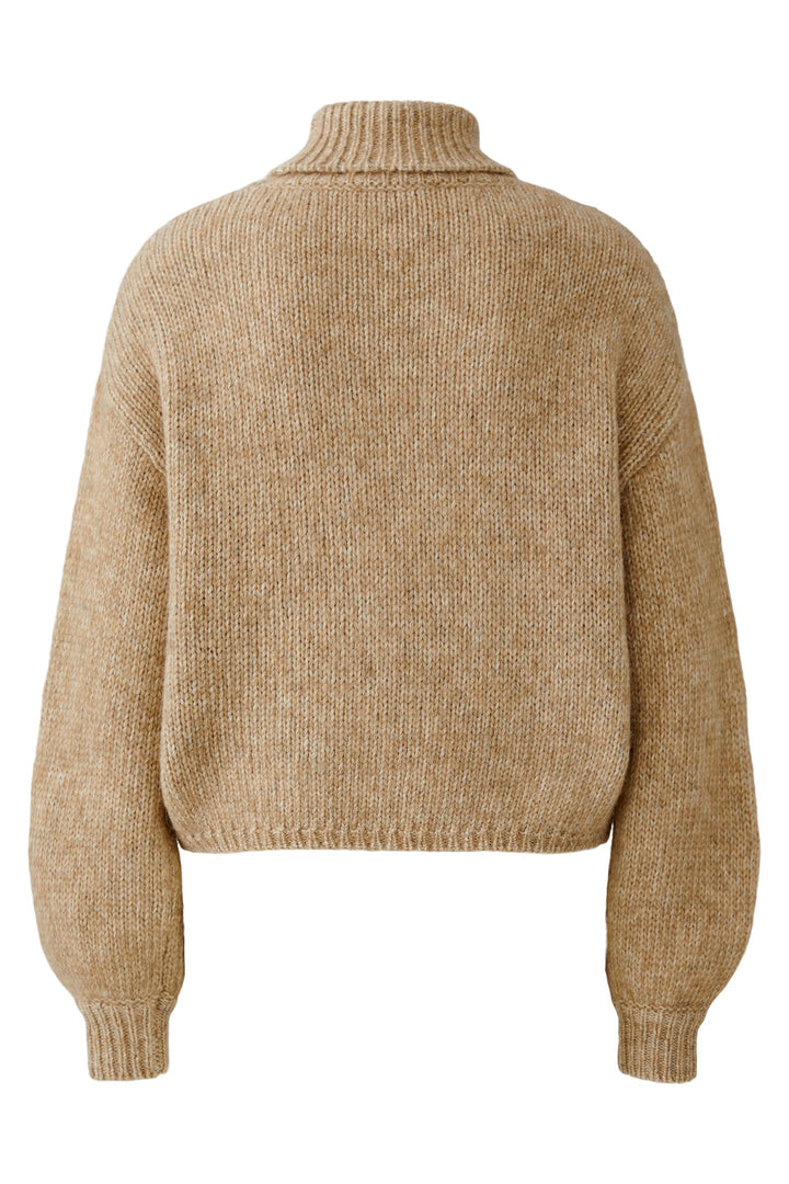 Beige knitted sweater on a white background