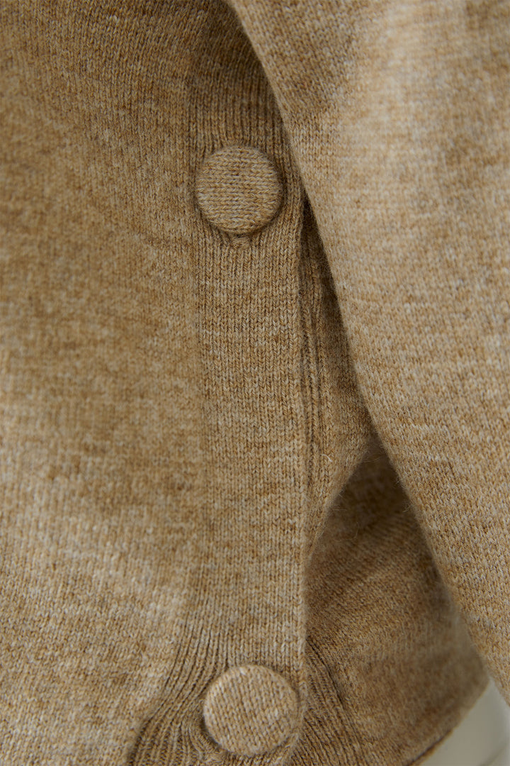Close-up of a beige textured fabric with buttons
