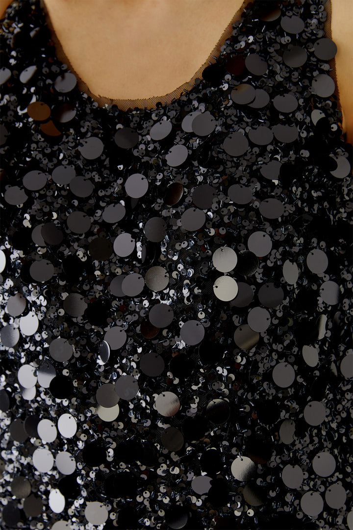 Close-up of a black sequin dress with a V-neckline.