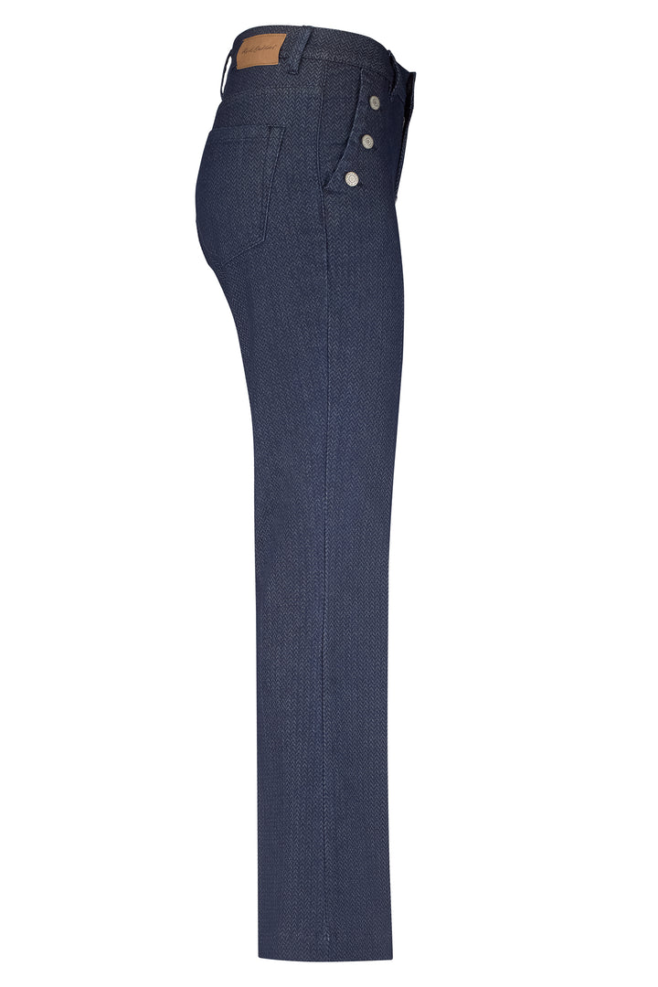 Blue jeans with button details on a white background