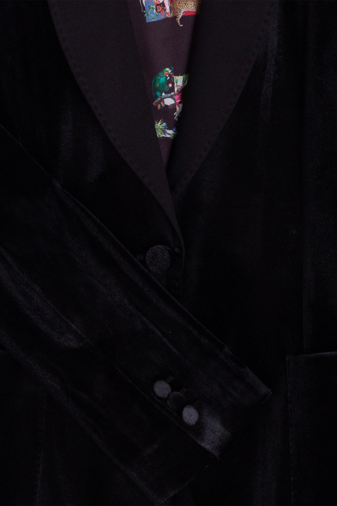 Close-up of a dark suit with a patterned tie