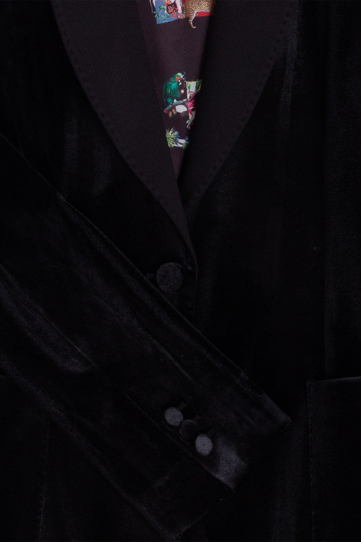 Close-up of a dark suit with a patterned tie