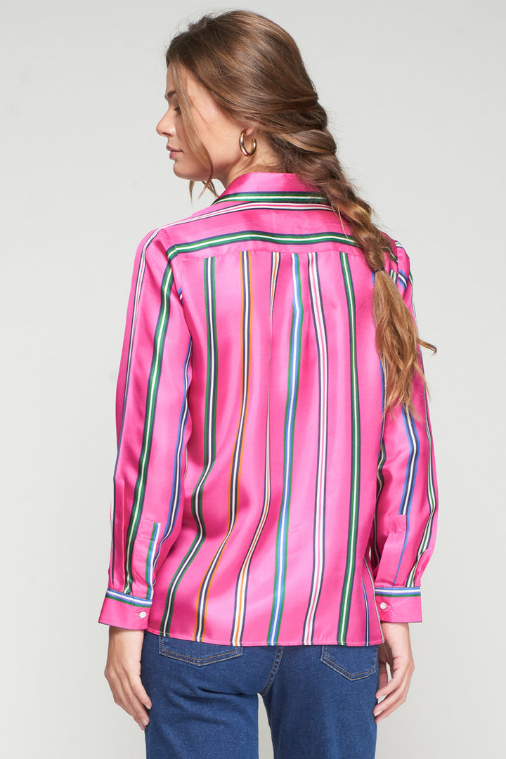 Woman wearing a pink striped shirt with a plain background