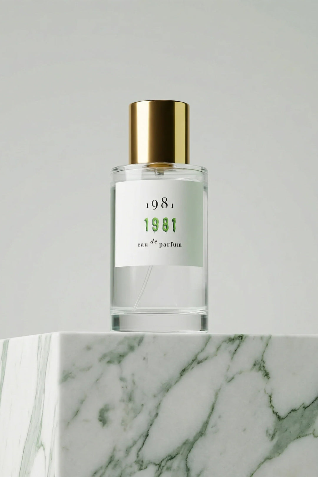 1981 Fragrance 1981 Eau De Parfum 100ml, bottle front on green marble