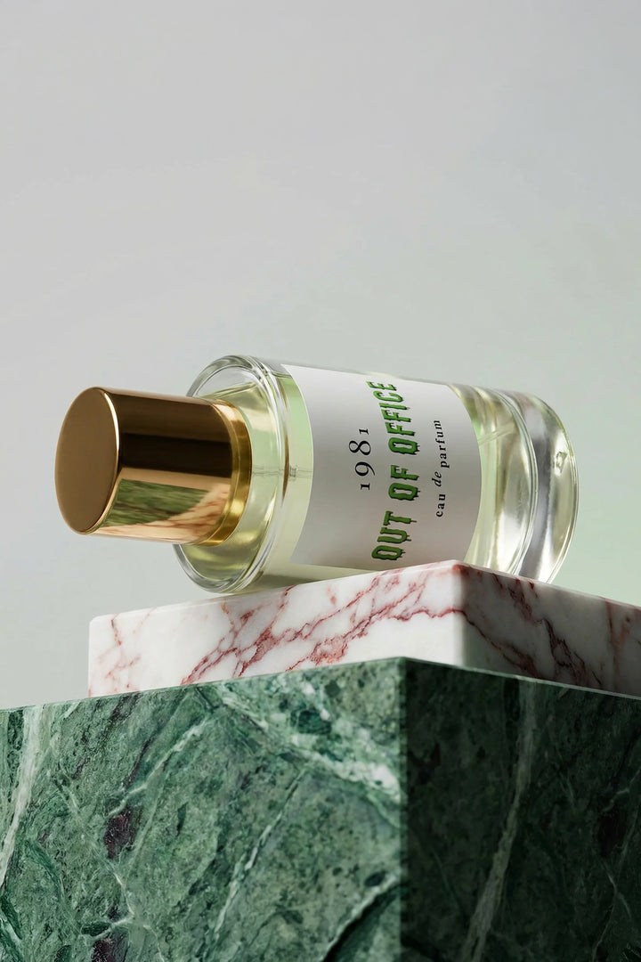 1981 Fragrance Out Of Office Eau De Parfum 100ml, bottle styled on pink and green marble