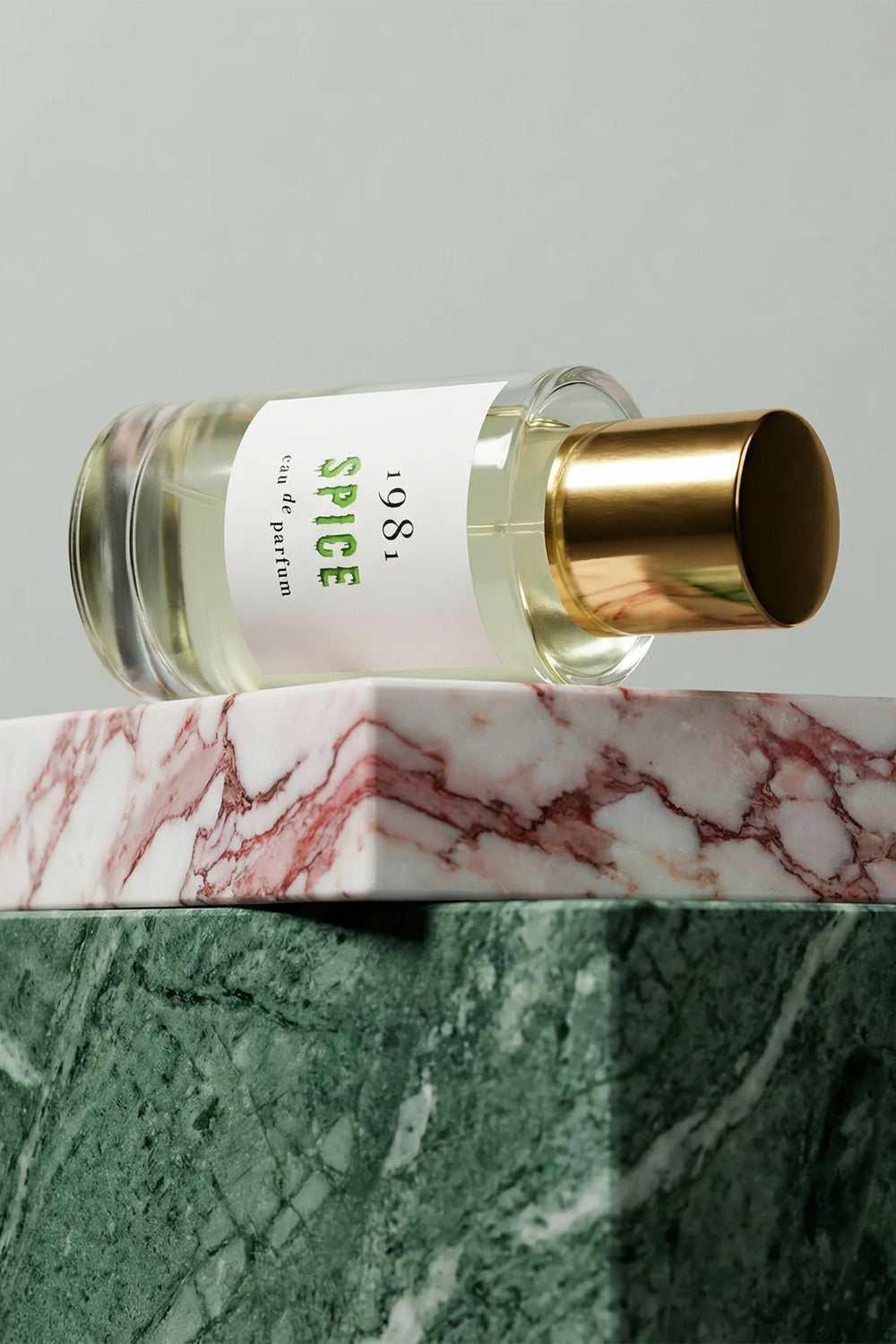 1981 Fragrance Spice Eau De Parfum 100ml, bottle styled on pink and white marble