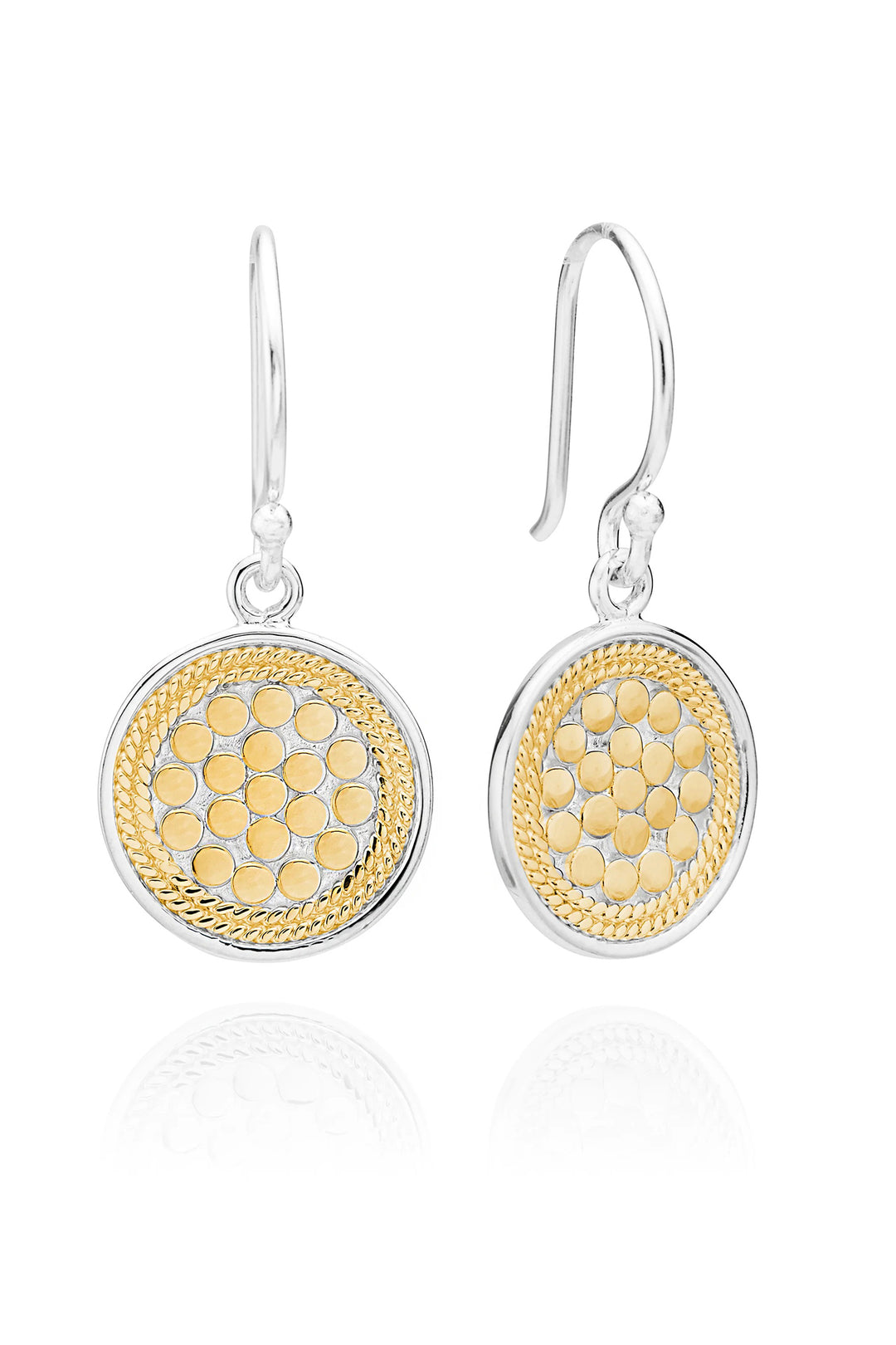 Pair of earrings with gold and silver designs on a white background