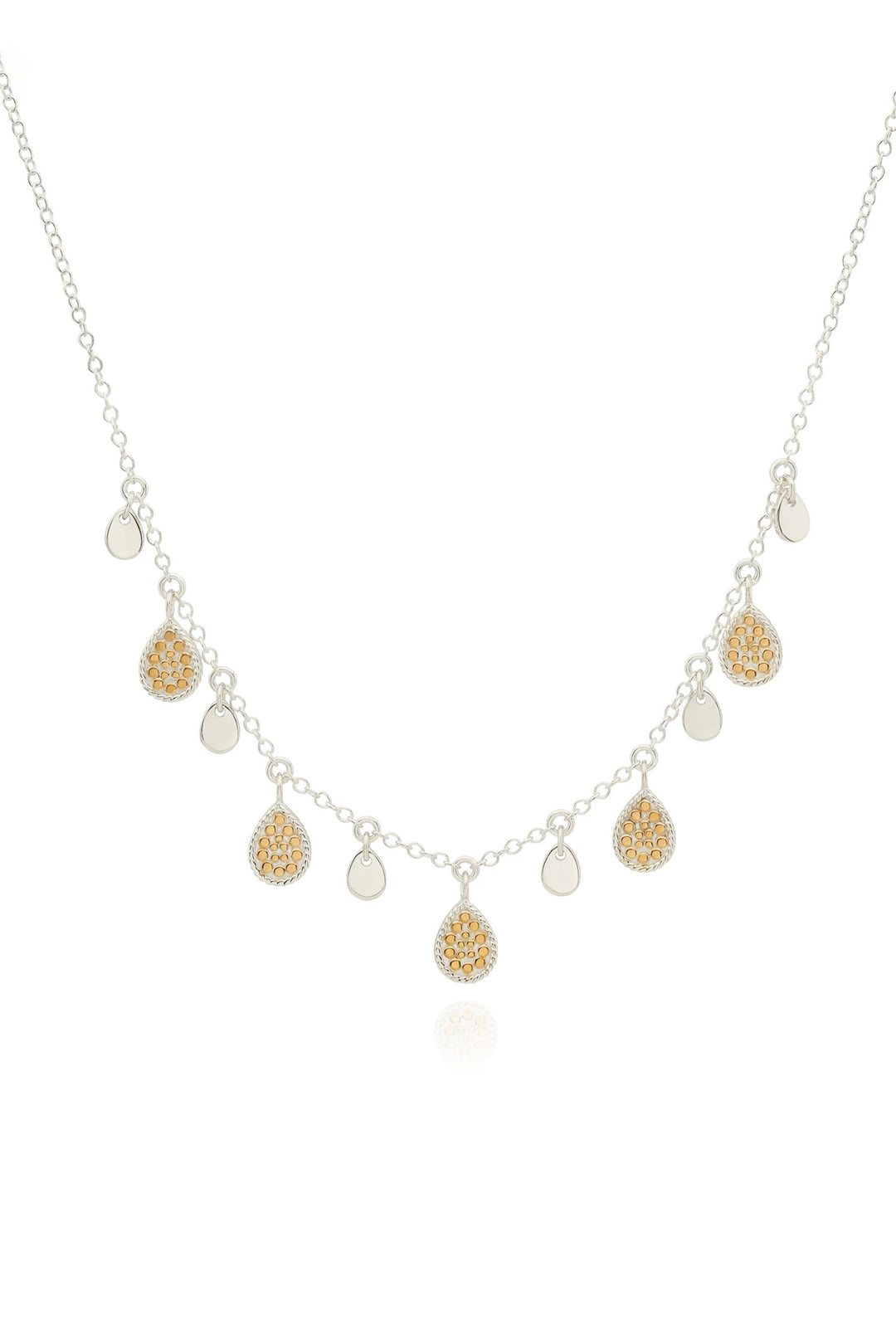 Necklace with gold and silver teardrop-shaped pendants on a white background