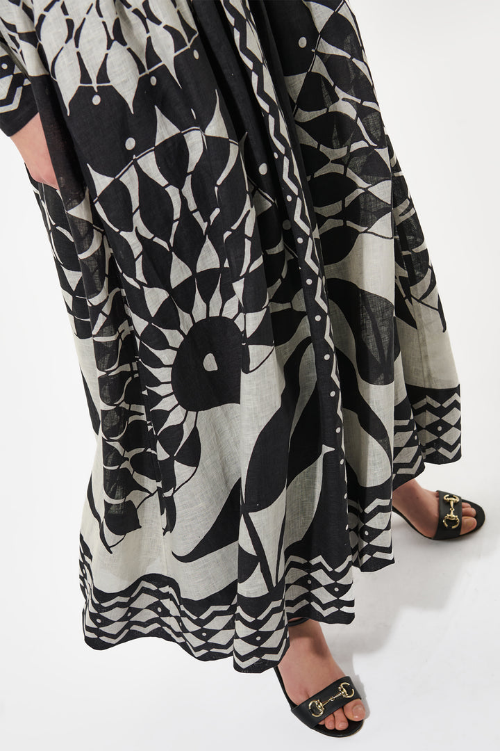 Black and white patterned dress with a plain background