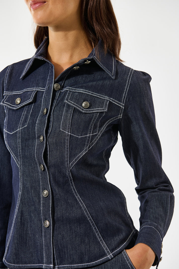 Denim shirt worn by a person on a white background