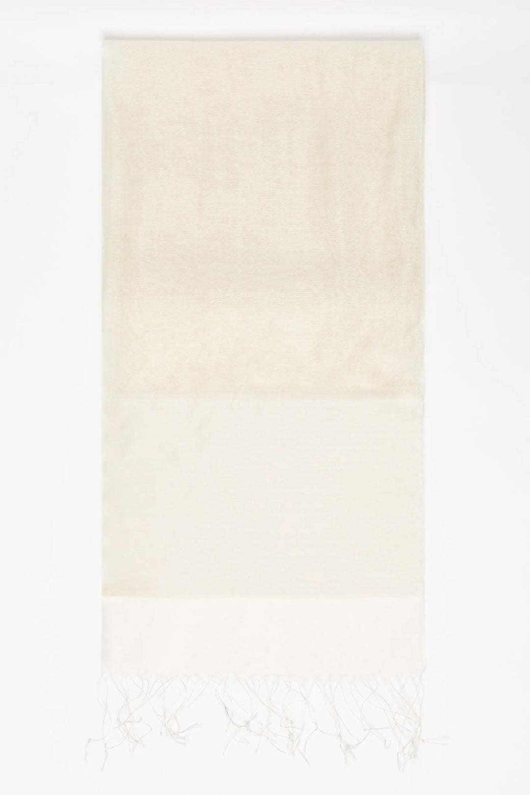 Gradient towel transitioning from light beige to white on a white background