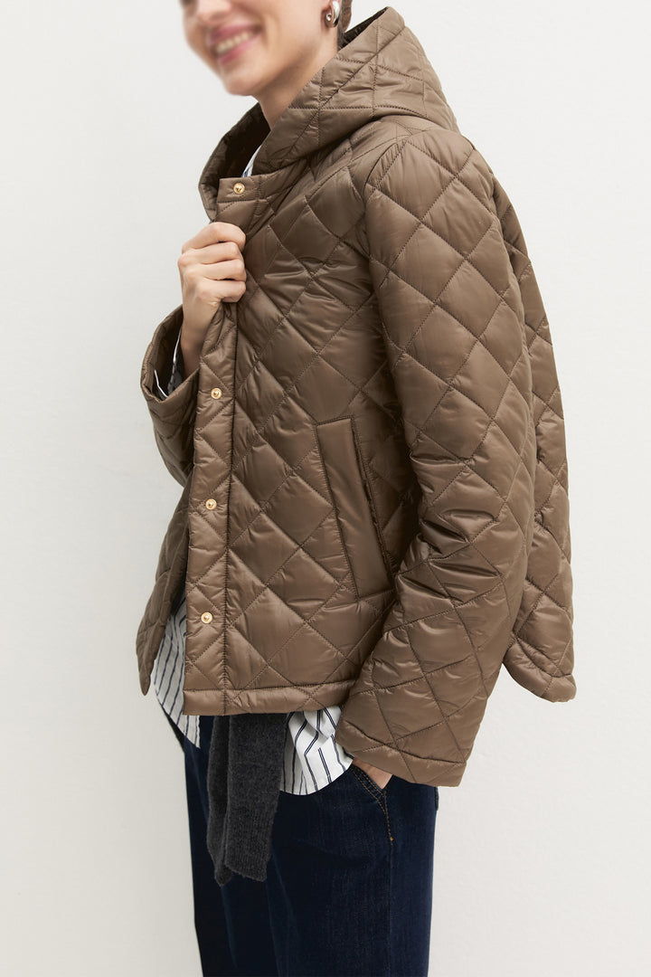 Emme Turtledove Brown Quilted Jacket, front model shot three-quarter view