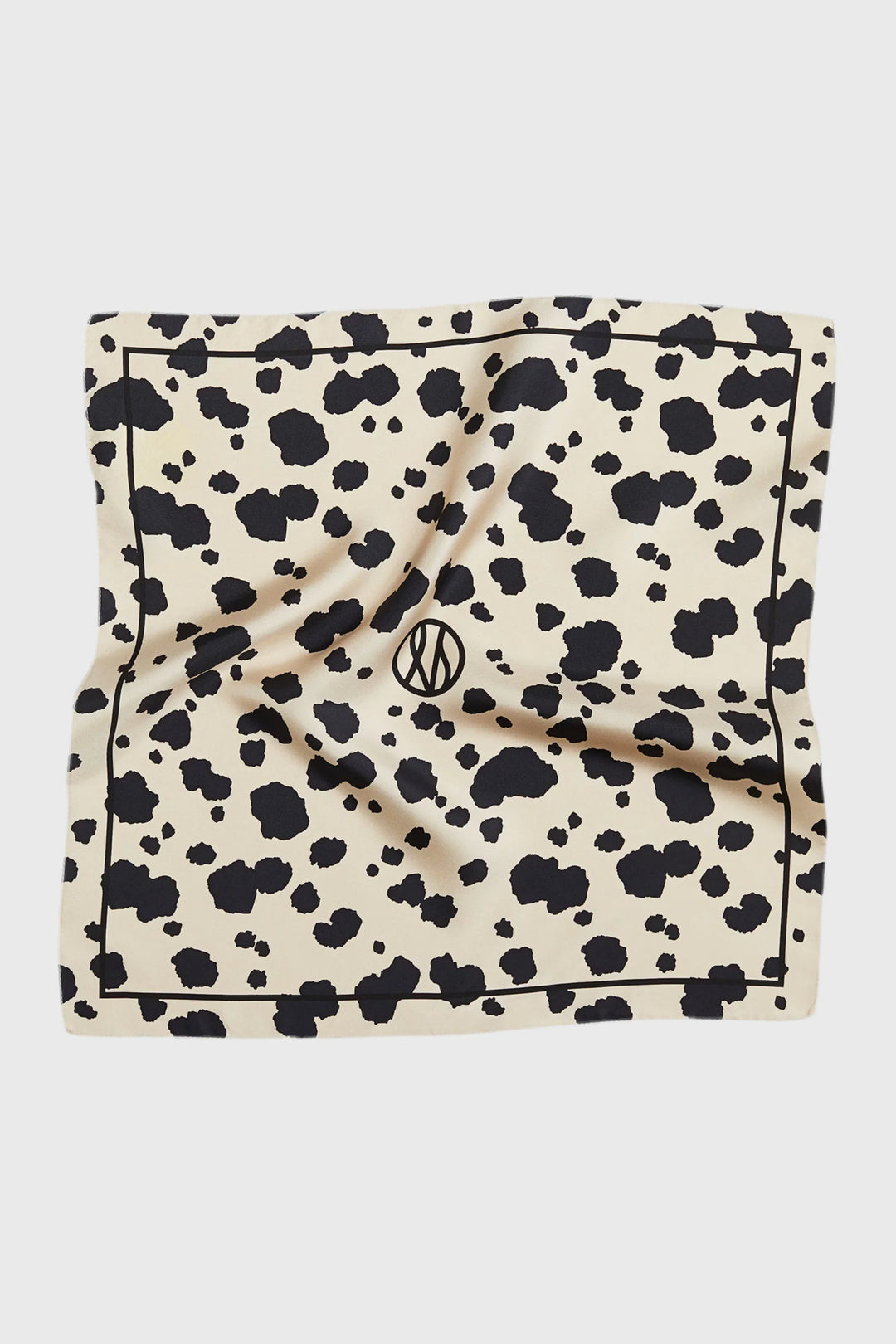 Scarf with black and white pattern on a beige background
