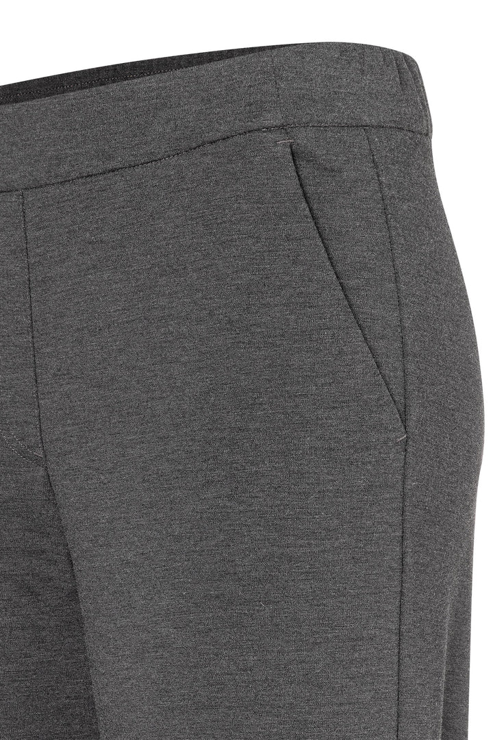 Close-up of gray pants with a white background