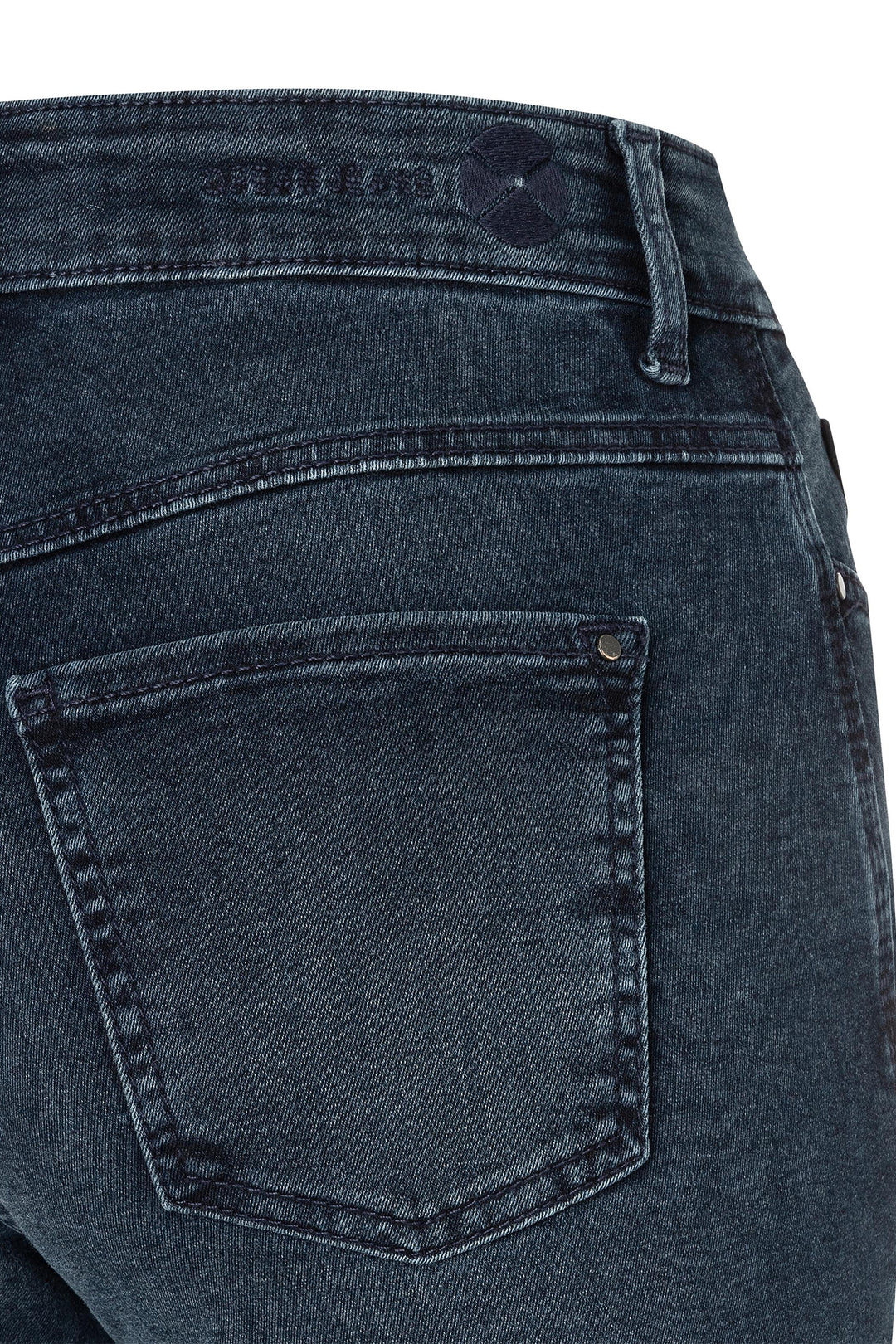 Close-up of blue denim jeans with a pocket on a white background