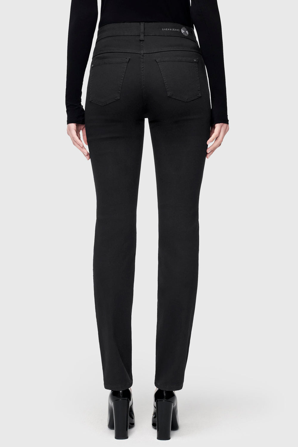 Black pants worn by a person on a white background