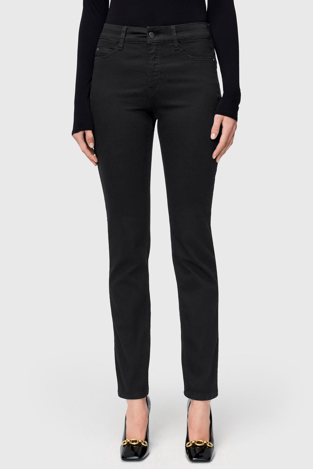 Black pants worn by a person on a white background