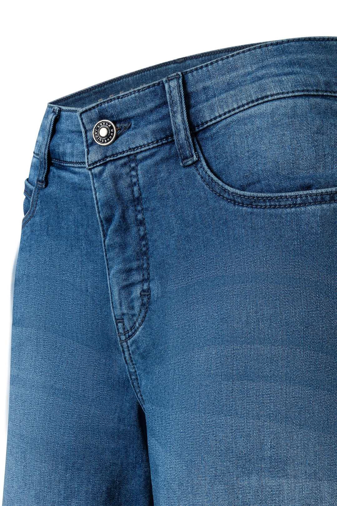 Close-up of blue jeans with a button on a white background