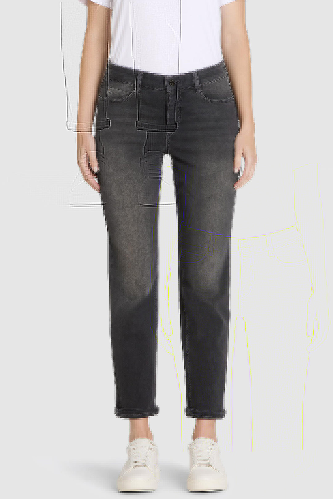 Person wearing black jeans and a white shirt on a light gray background