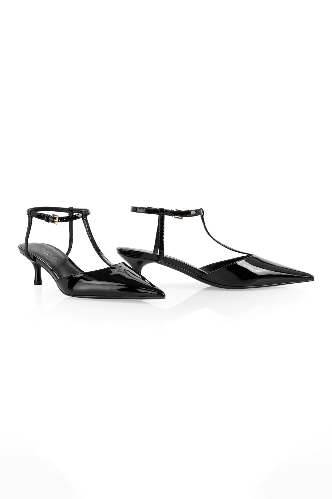 Pair of black high-heeled shoes with thin straps on a white background