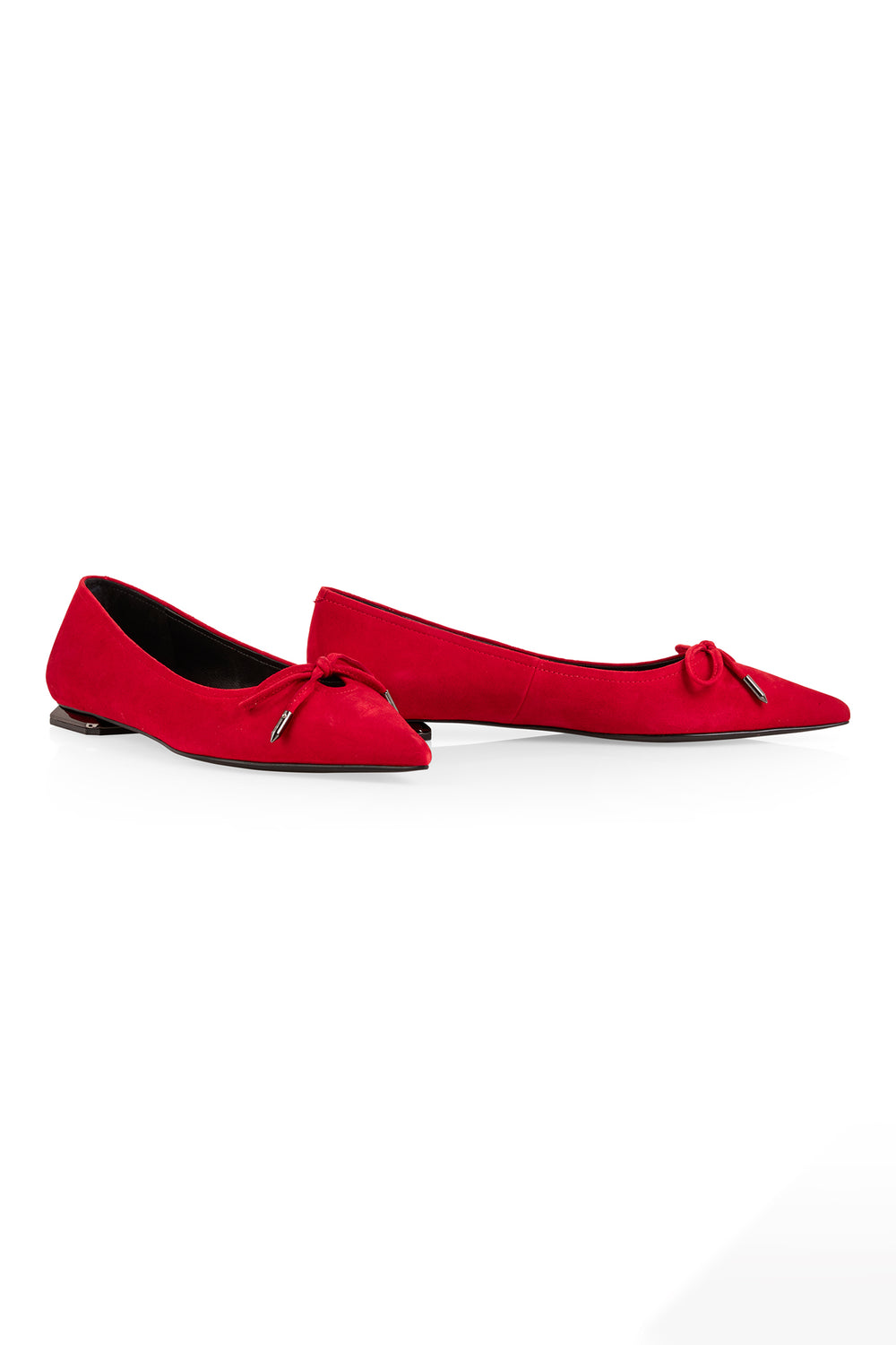 Pair of red flats with a bow on a white background
