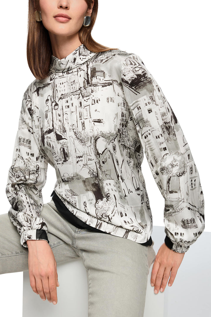 Woman wearing a patterned jacket on a white background