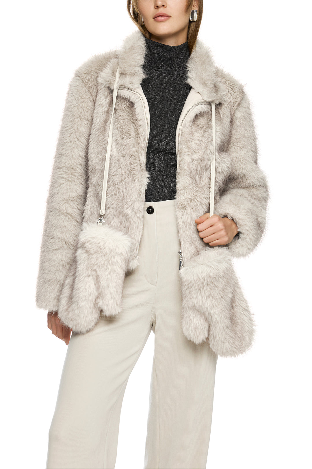 Person wearing a fluffy gray coat with a white background