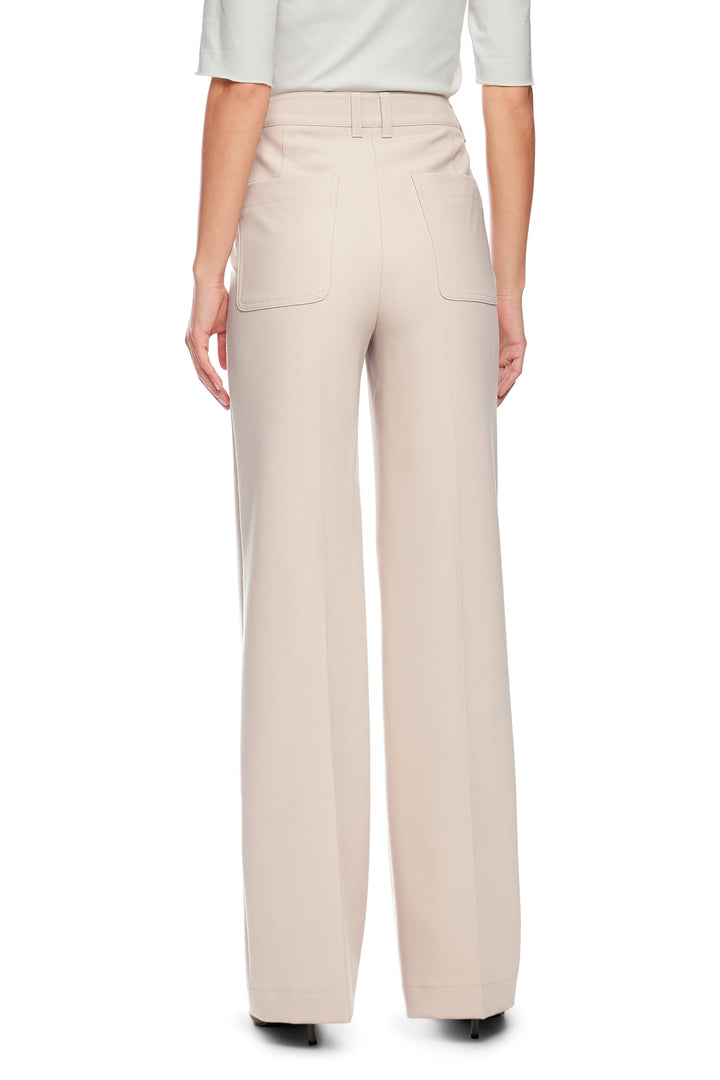 Beige pants worn by a person on a white background