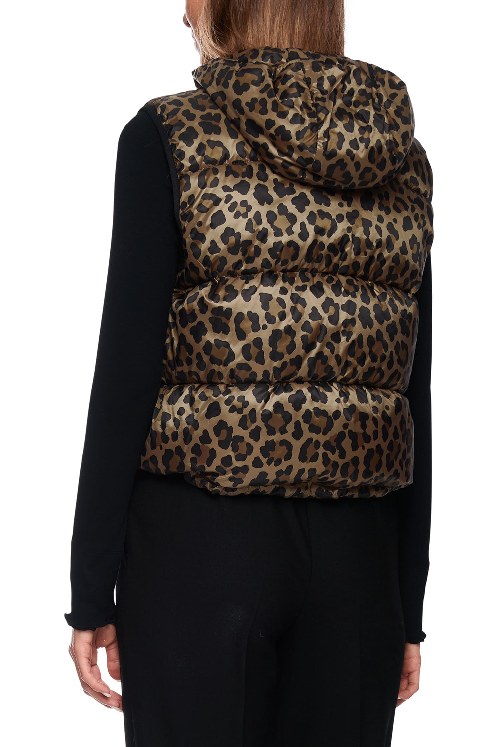Leopard print puffer vest worn by a person on a white background