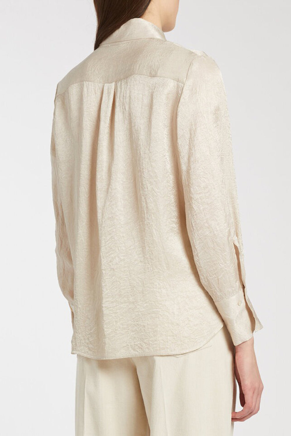 Beige linen shirt and pants on a white background