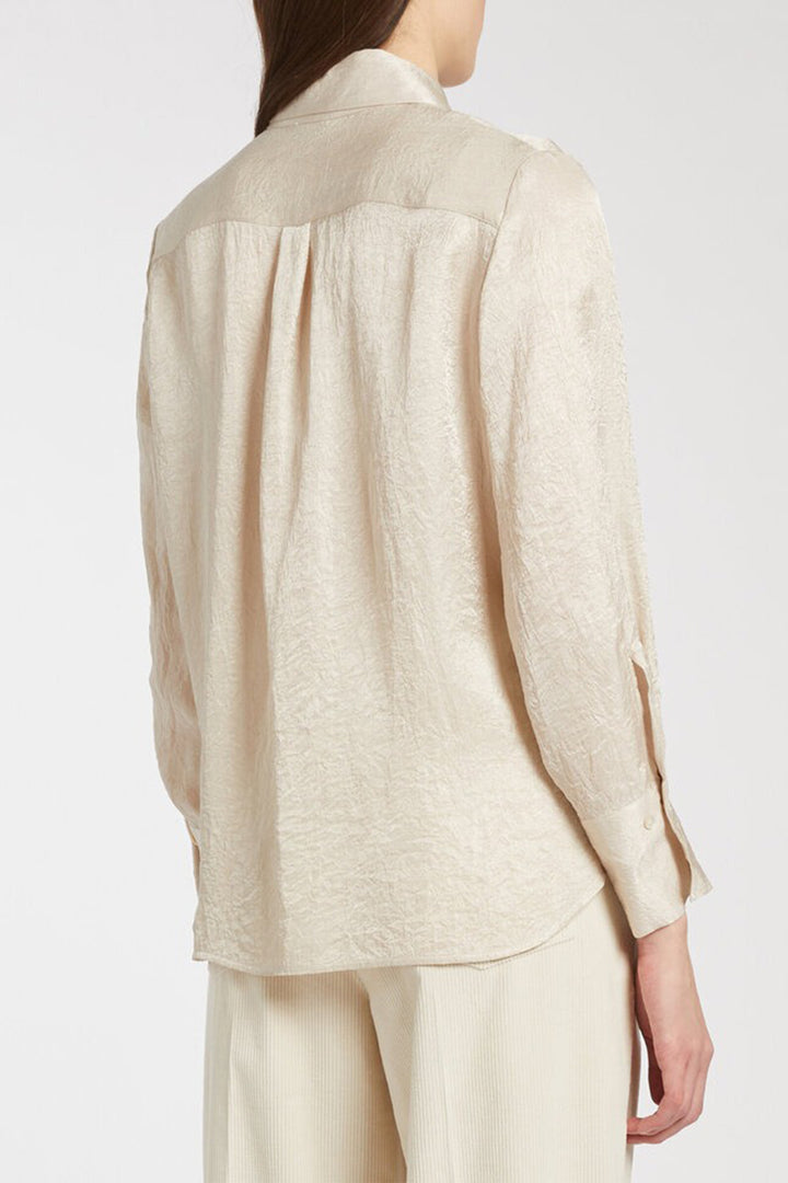 Beige linen shirt and pants on a white background