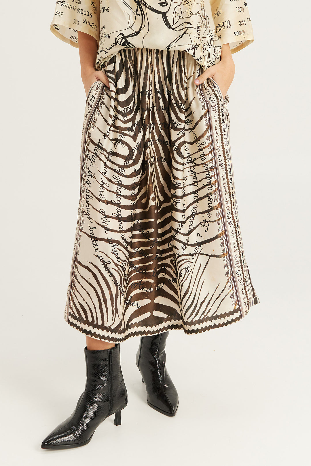 Me369 Vanessa Noir Muse midi skirt at Olivia Grace Fashion