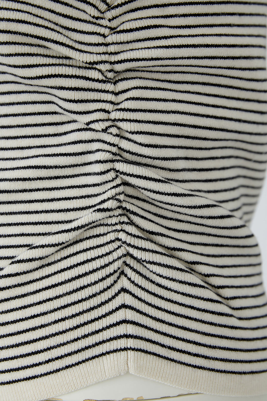 Close-up of a textured fabric with black and white stripes