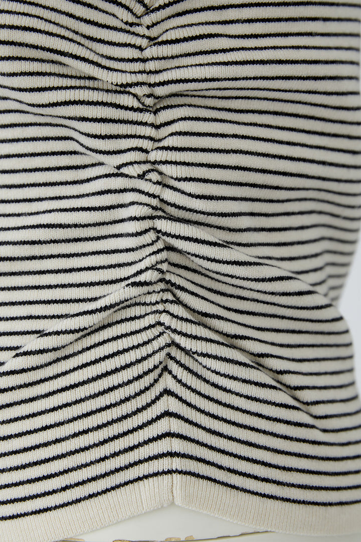 Close-up of a textured fabric with black and white stripes
