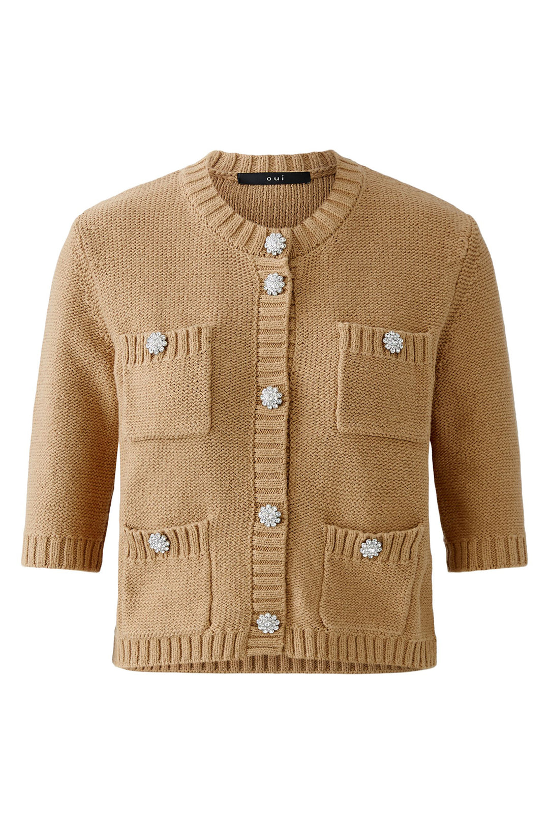 Beige knitted cardigan with decorative buttons on a white background