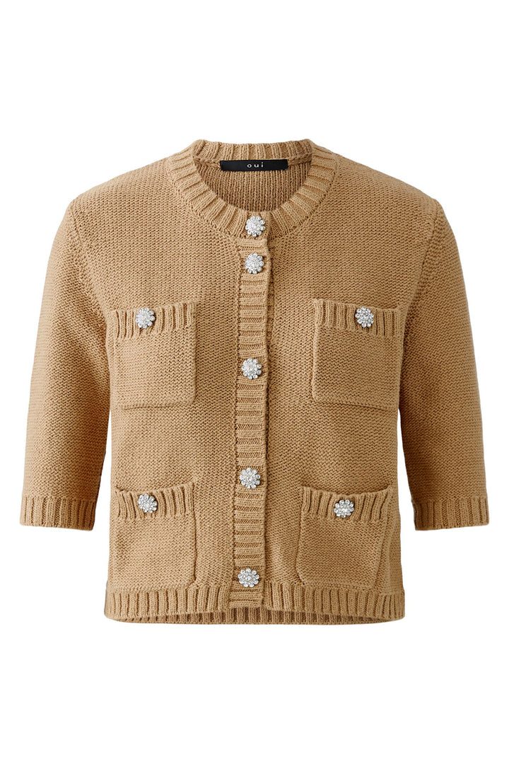 Beige knitted cardigan with decorative buttons on a white background