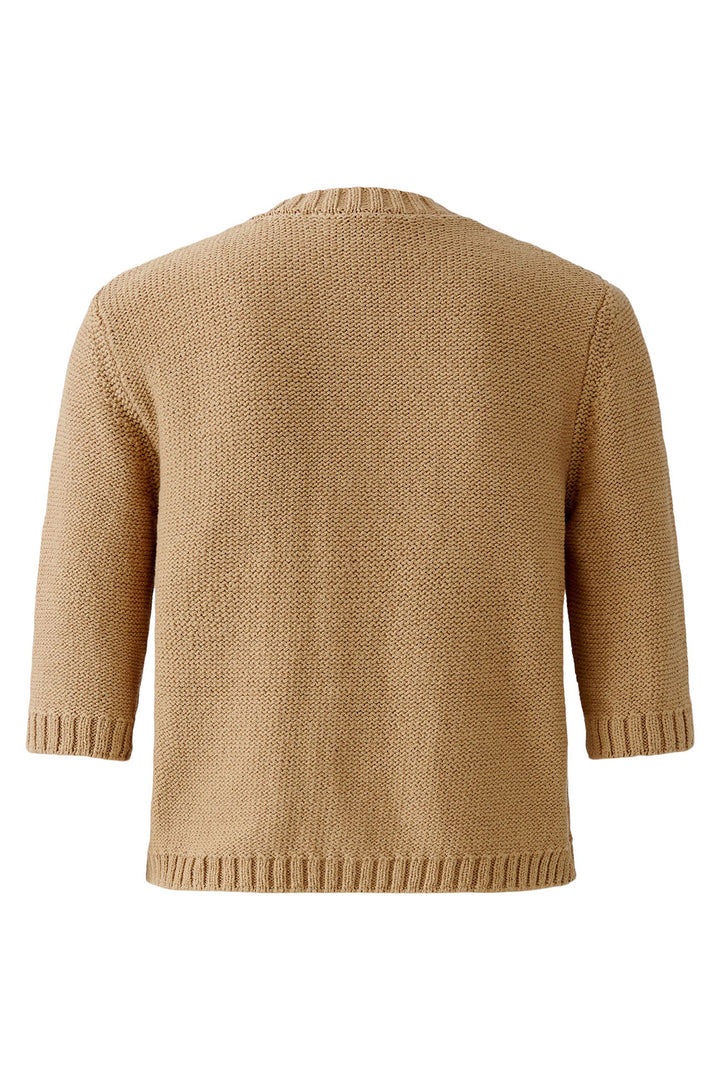 Beige knitted sweater on a white background