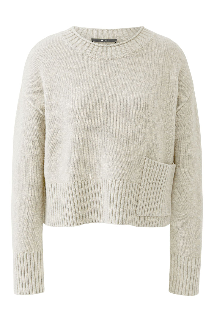 Beige sweater with a pocket on a white background