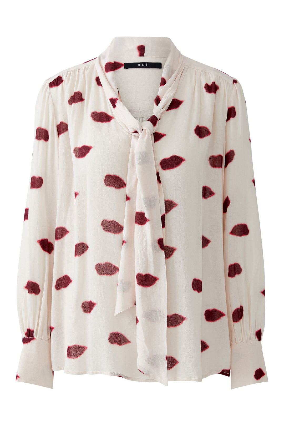 White blouse with red heart pattern on a white background