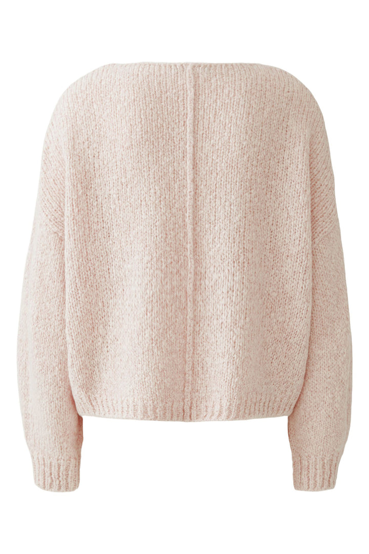 Pink sweater on a white background